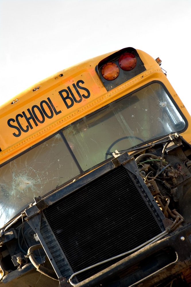 A dump truck crashes into three school buses in Libertyville